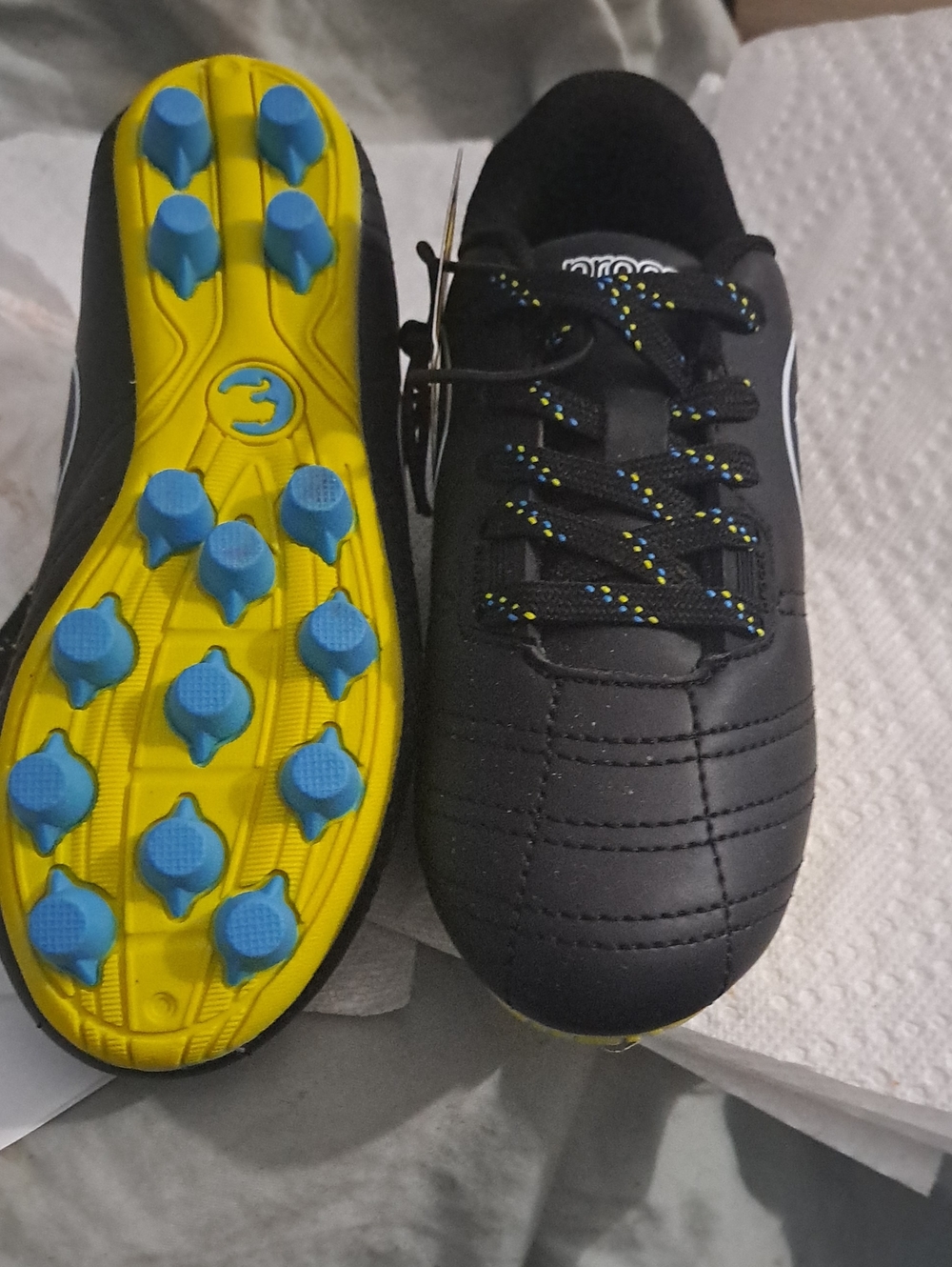 Puma Kids Black Soccer Cleats with Yellow Sole and Blue Studs